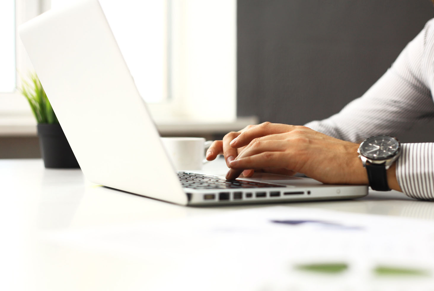 businessman is typing on keyboard in office